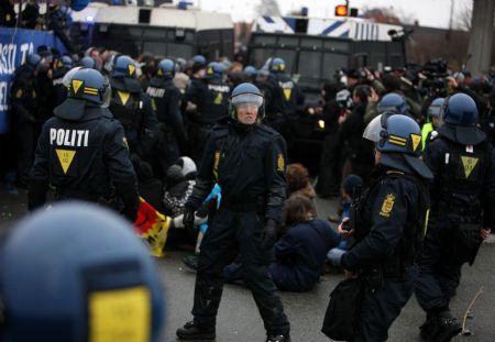 Protesters are detained outside Bella center in Copenhagen, Denmark, December 16, 2009.