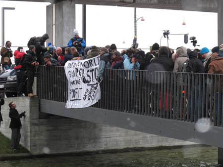Protesters cross the bridge to the venue of the United Nations Climate Change Conference 2009 in Copenhagen December 16, 2009.