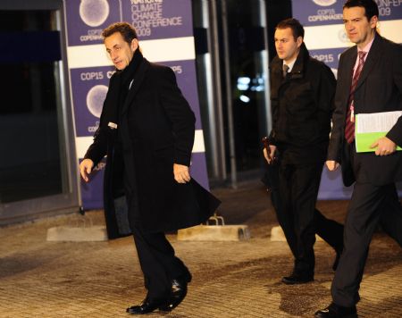 France&apos;s President Nicolas Sarkozy (L) arrives at the venue of the United Nations Climate Change Conference in Copenhagen, capital of Denmark, December 18, 2009. 