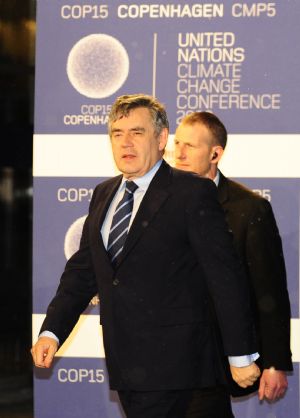 British Prime Minister Gordon Brown (front) arrives at the venue of the United Nations Climate Change Conference in Copenhagen, capital of Denmark, December 18, 2009.