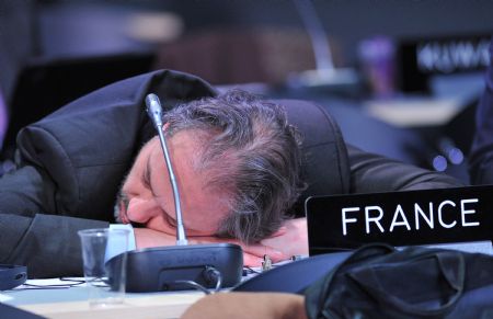 A representative takes a rest during the UN Climate Change Conference in Copenhagen, capital of Denmark, on December 19, 2009.