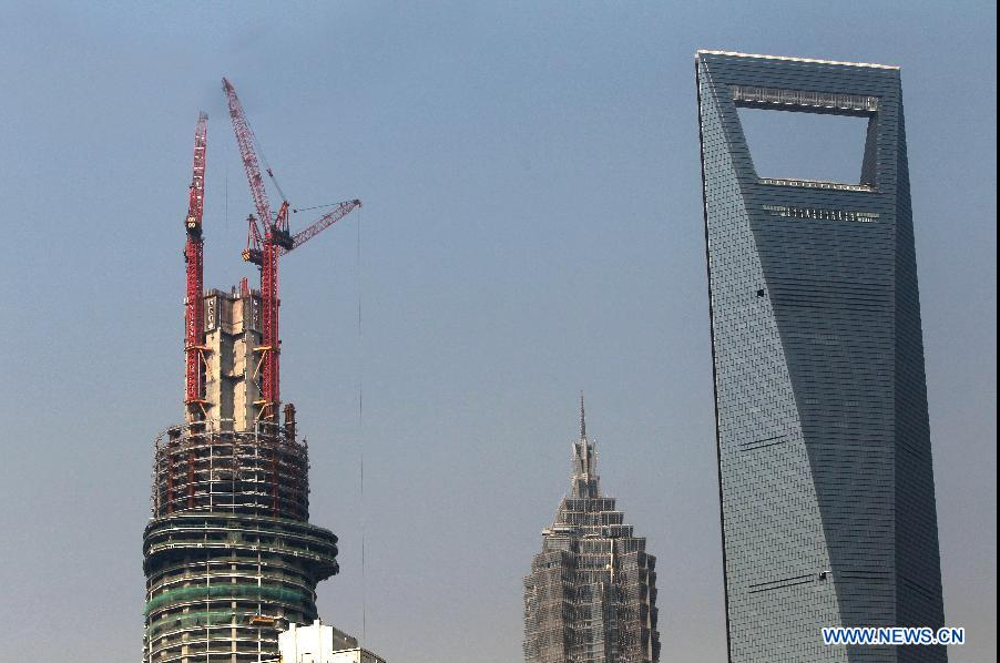 Photo taken on Dec. 8, 2012 shows the Shanghai Tower, a skyscraper under construction, in Pudong, east China's Shanghai Municipality. The Shanghai Tower is expected to reach 632 meters in height and start service in 2015.[Photo/Xinhua]