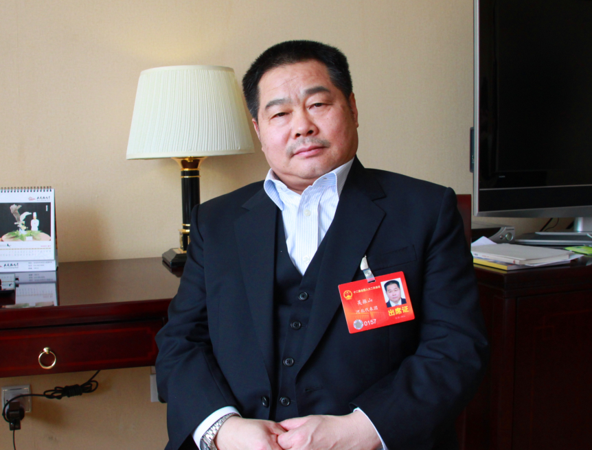 Wu Zhenshan, chairman of Tianshan Group in Hebei Province, proposed to use overall communities to solve the issue of the aging population in China.[Photo/China.org.cn]