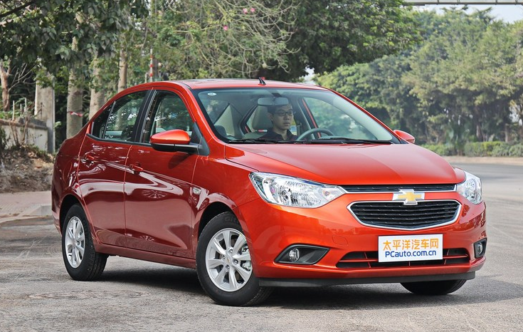 A Chinese visitor tries out a Chevrolet Sail of Shanghai GM, a joint venture between SAIC Motor and General Motors.[File photo]