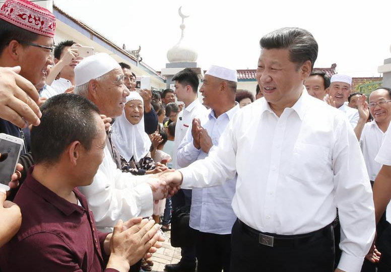 Chinese President Xi Jinping shakes hands with villagers at the Yuanlong Relocation Village of Minning Town in Yinchuan, capital of northwest China's Ningxia Hui Autonomous Region, July 19, 2016. Xi Jinping made a three-day inspection tour in Ningxia.[Photo/Xinhua]
