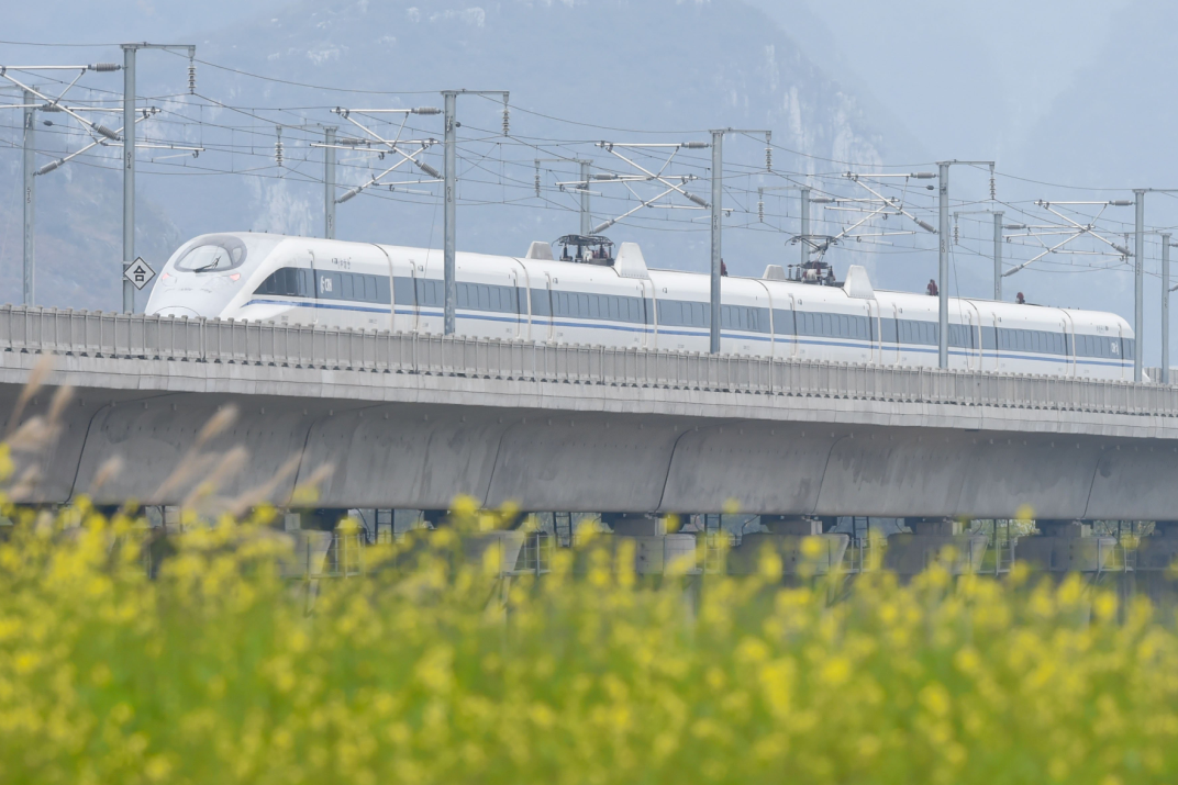A test train in seen on the Guizhou West section of the Shanghai-Kunming high-speed railway, Dec. 17, 2016. The railway is one of the world's longest high-speed railways, linking the country's prosperous eastern coast to the less-developed southwest.