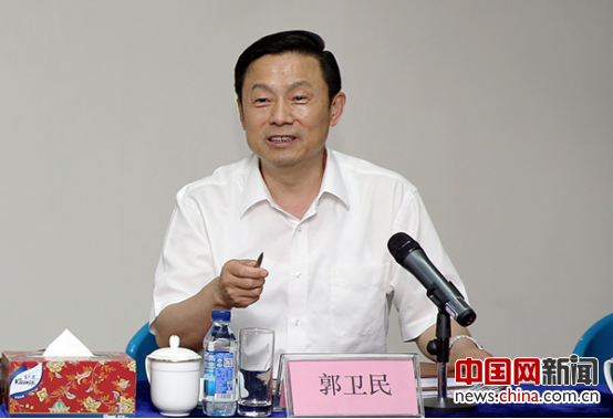 Guo Weimin, vice minister of the State Council Information, hosts the seminar in Beijing on July 18. [Photo/China.org.cn]