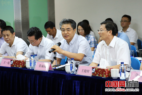 Zhang Fuhai (R2, First row), president of China International Publishing Group, attends the seminar in Beijing on July 18. [Photo/China.org.cn]