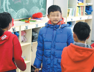 Xiaolei (center) with his classmates at Jilin Orphan School in Changchun, Jilin province. [Photo/China Daily]