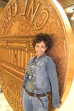 Wander Martich poses in front of her gigantic penny.