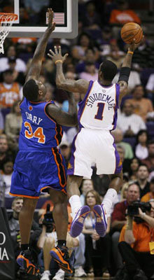 Phoenix Suns' Steve Nash is guarded by New York Knicks' Nate