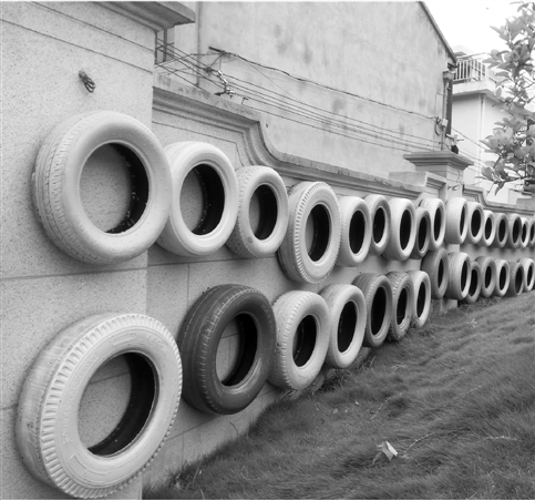 48个旧轮胎 建起慈溪幼儿园的安全墙