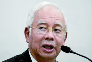 马来西亚总理否认7亿美元丑闻 或起诉华尔街日