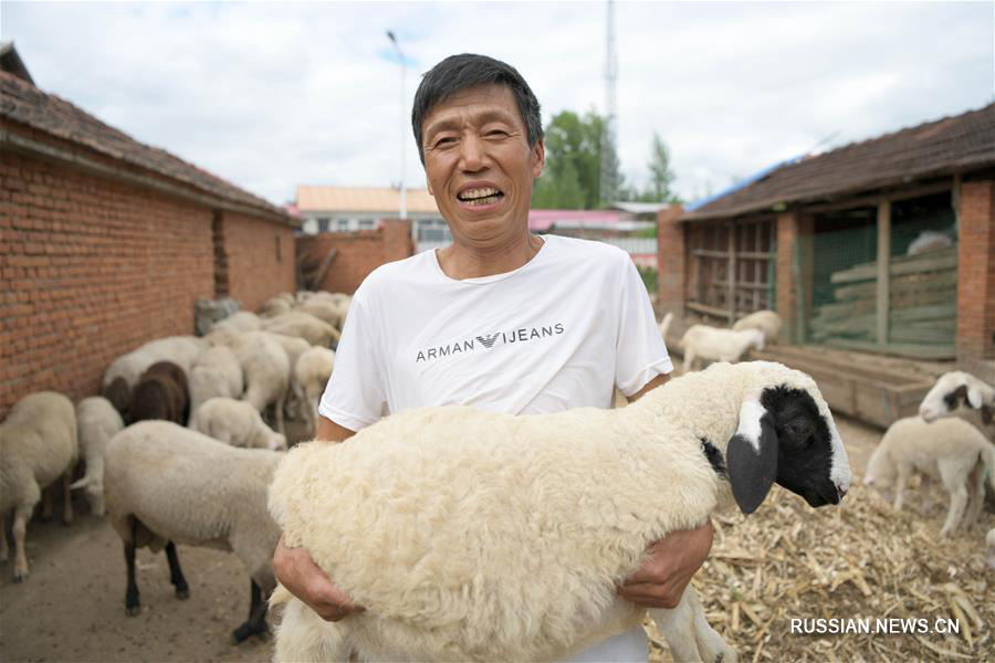 Улыбка как символ победы над бедностью в провинции Хэйлунцзян 