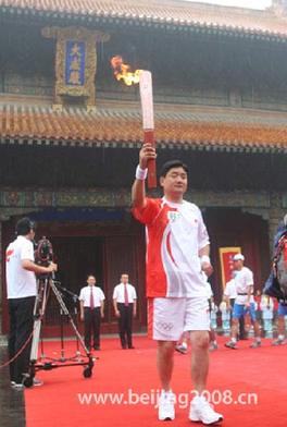A descendant of Confucius', Kong Peng kicks off the Olympic torch relay in Qufu, Shandong Province July 22.