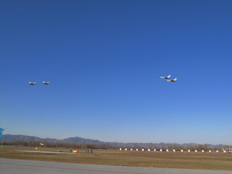  Photo taken on November 15 shows four J-10 fighter planes perform during an air force show in Beijing Shahe airport. The show was staged to celebrate the 60th anniversary of the founding of People&apos;s Liberation Army (PLA) Air Force. [Jiang Yiping/China.org.cn]