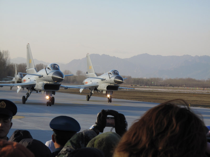 Photo taken on November 15 shows two J-10 fighter planes just finish performance and greet the crowd during an air force show in Beijing Shahe airport. [Jiang Yiping/China.org.cn]