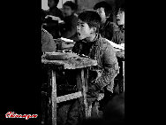 Students are very concentrated in their class. As many as one million students drop out of school every year in China due to poverty.