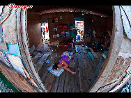 People sleep on the floor as there are no bed in the room. The Bajau Laut, known as 'the Sea Gypsies,' live at the seaside of Malaysia and the Philippines. They build and live in tatty wooden sheds above the water and make a living by fishing. They have no access to education due to poverty and live on the margins of society.