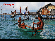 Children learn the skills of surviving on the sea at an early age. The Bajau Laut, known as 'the Sea Gypsies,' live at the seaside of Malaysia and the Philippines. They build and live in tatty wooden sheds above the water and make a living by fishing. They have no access to education due to poverty and live on the margins of society.