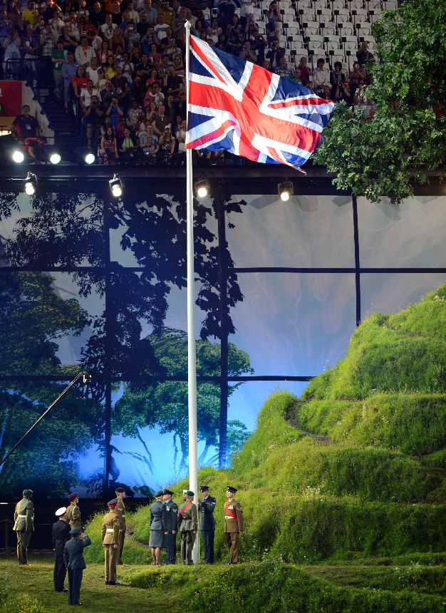 The national flag of the United Kingdom, the Union Jack, is being hoisted at London Olympic Stadium accompanied with the British national anthem God Save the Queen. [Xinhua]