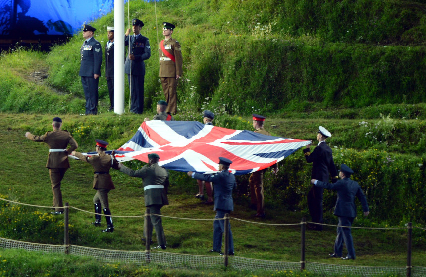 The national flag of the United Kingdom, the Union Jack, is being hoisted at London Olympic Stadium accompanied with the British national anthem God Save the Queen. [Xinhua]