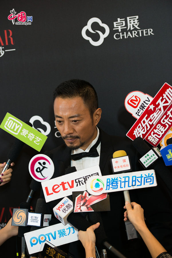 Zhang Hanyu takes questions from entertainment press on Sunday, Sept. 21, 2014, at the closing ceremony of Charter Beijing Fashion Week, held at Charter Wukesong Store in downdown Beijing. [Chen Boyuan / China.org.cn]