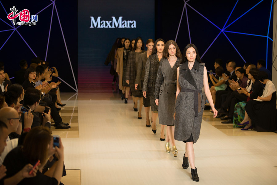 Italian name brand MaxMara launches its latest trendy wears for this upcoming autumn and winter on Sunday, Sept. 21, 2014, at the Charter Wukesong Shopping Center in Beijing. The latest MaxMara fashion features yellow and brown colours. [Photo by Chen boyuan]