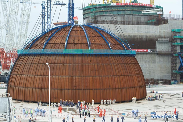 Staff members prepare for the dome installation at No. 5 unit of Fuqing Nuclear Power Plant in Fuqing, southeast China's Fujian Province, May 25, 2017. As the containment dome installation was completed in Fuqing on Thursday, China's first demonstration nuclear power project using Hualong One technology, a domestically developed third-generation reactor design, has taken shape. (Xinhua/Jiang Kehong)