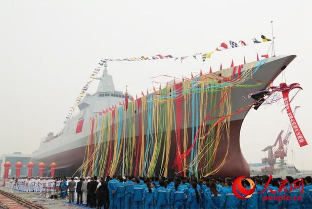 The Navy&apos;s new destroyer, a 10,000-tonne domestically designed and produced vessel, is launched at Jiangnan Shipyard (Group), Shanghai, June 28, 2017. [Photo/people.cn]