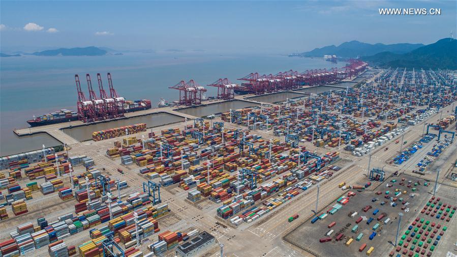 Aerial photo taken on July 12, 2017 shows the container pier of Zhoushan Port in Ningbo City, east China&apos;s Zhejiang Province. In the first half of 2017, Zhoushan Port handled 515 million tonnes cargoes, up 11.3 percent year-on-year, and 12.39 million TEU (twenty-foot equivalent unit) containers, up 14.6 percent year-on-year. [Photo/Xinhua]