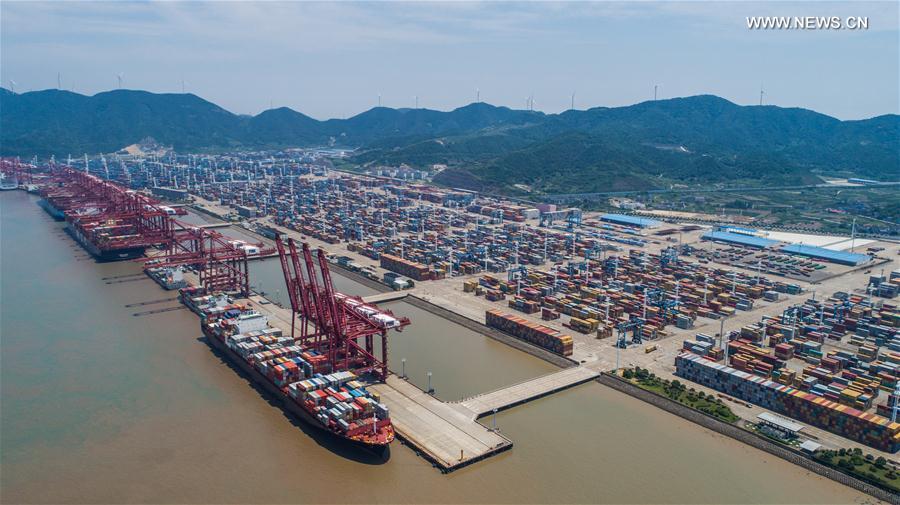 Aerial photo taken on July 12, 2017 shows the container pier of Zhoushan Port in Ningbo City, east China&apos;s Zhejiang Province. In the first half of 2017, Zhoushan Port handled 515 million tonnes cargoes, up 11.3 percent year-on-year, and 12.39 million TEU (twenty-foot equivalent unit) containers, up 14.6 percent year-on-year. [Photo/Xinhua]