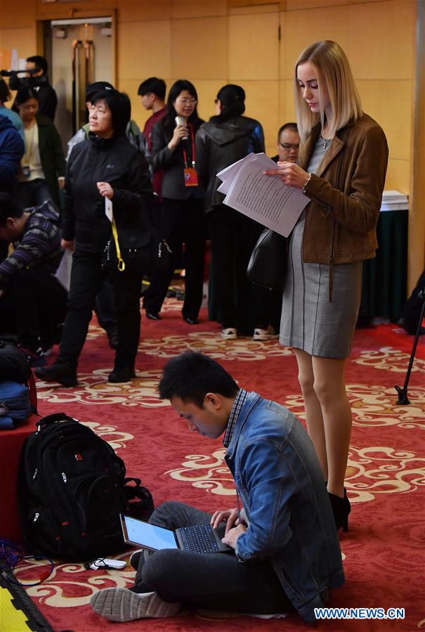 Journalists work at a press conference held by the press center of the 19th National Congress of the Communist Party of China (CPC) in Beijing, capital of China, Oct. 22, 2017. 