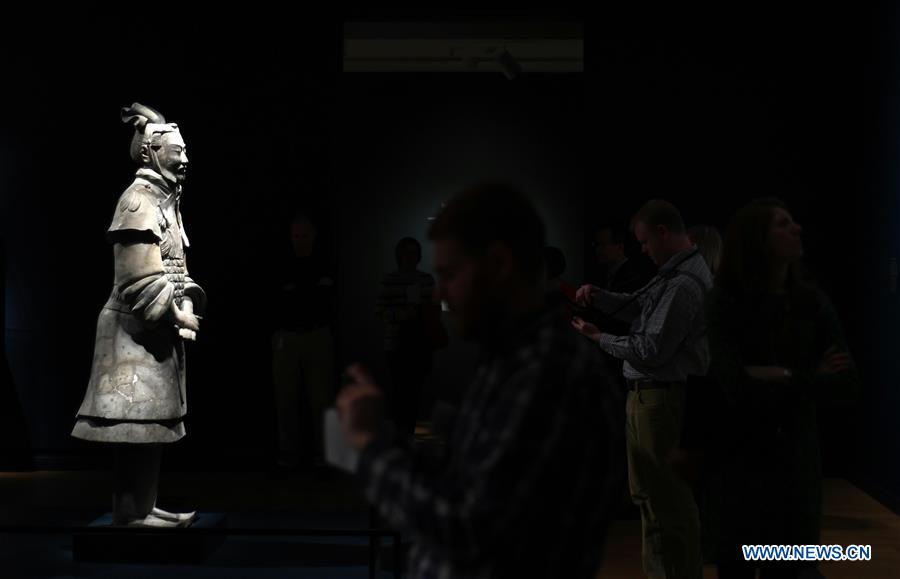 People view a terracotta warrior during a press preview at the Virginia Museum of Fine Arts (VMFA) in Richmond, Virginia, the United States, on Nov. 15, 2017. Titled &apos;Terracotta Army: Legacy of the First Emperor of China,&apos; the exhibition features more than 130 artifacts, including 10 life-size terracotta warriors. The exhibition will be at VMFA from Nov. 18 to March 11, 2018. (Xinhua/Yin Bogu) 