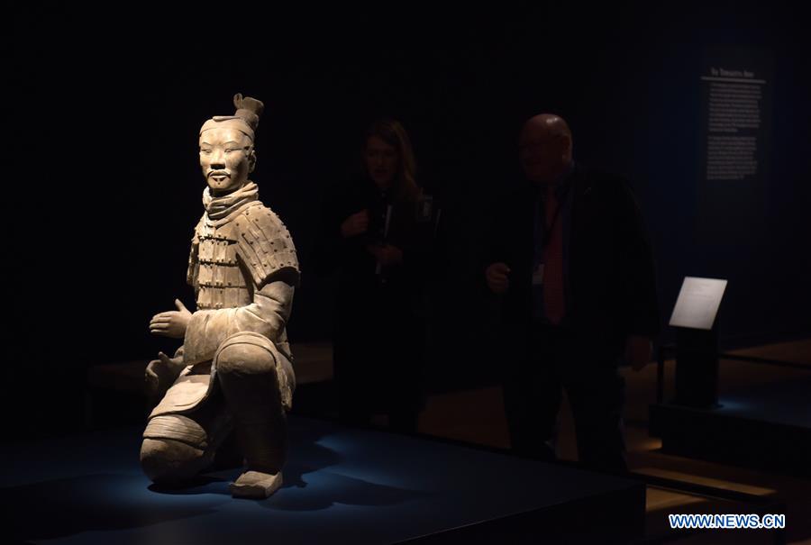 People view a terracotta warrior during a press preview at the Virginia Museum of Fine Arts (VMFA) in Richmond, Virginia, the United States, on Nov. 15, 2017. Titled &apos;Terracotta Army: Legacy of the First Emperor of China,&apos; the exhibition features more than 130 artifacts, including 10 life-size terracotta warriors. The exhibition will be at VMFA from Nov. 18 to March 11, 2018. (Xinhua/Yin Bogu) 