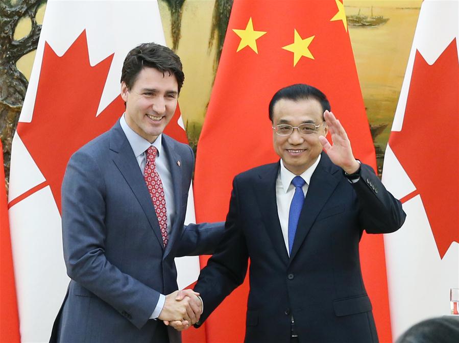 Chinese Premier Li Keqiang and Canadian Prime Minister Justin Trudeau meet the press after the second meeting of the Annual Dialogue between the Chinese premier and the Canadian prime minister in Beijing, capital of China, Dec. 4, 2017. [Photo/Xinhua]