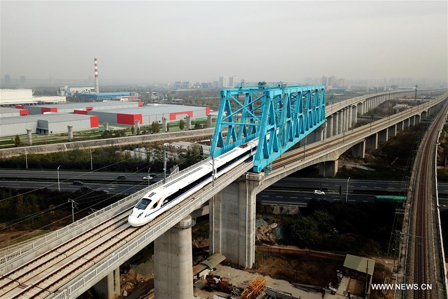 A bullet train runs on a bridge of Xi'an-Chengdu high-speed railway during a test in northwest China's Shaanxi Province, Nov. 22, 2017. [Photo/Xinhua]
