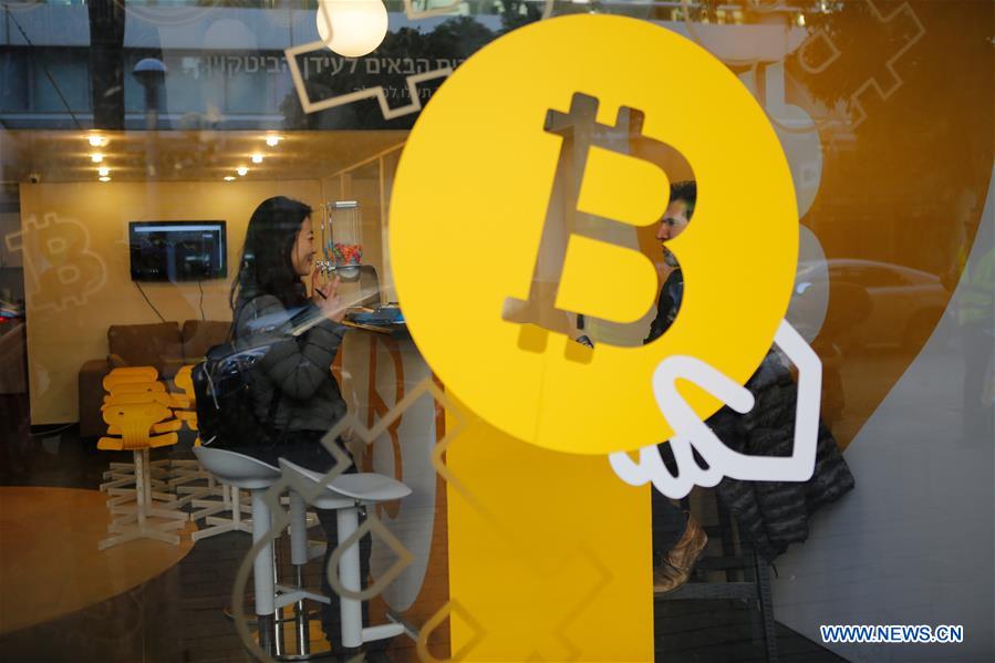A woman buys Bitcoin at Bitcoin Change in Tel Aviv, Israel, on Jan. 8, 2018. [Photo/Xinhua]