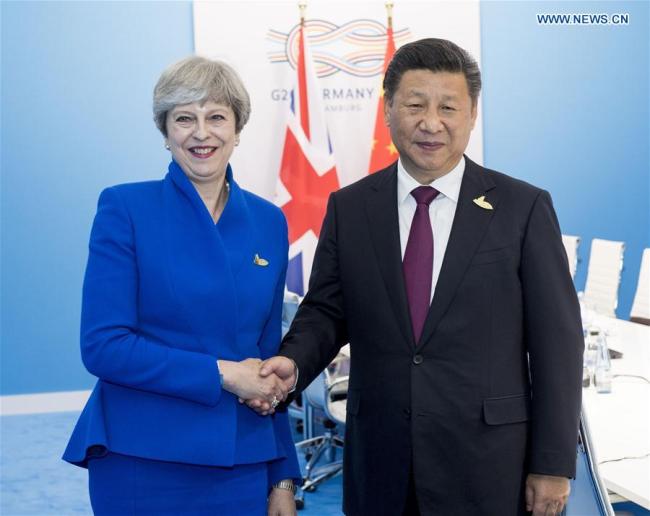 Chinese President Xi Jinping meets with British Prime Minister Theresa May in Hamburg, Germany, July 7, 2017. [Photo/Xinhua]