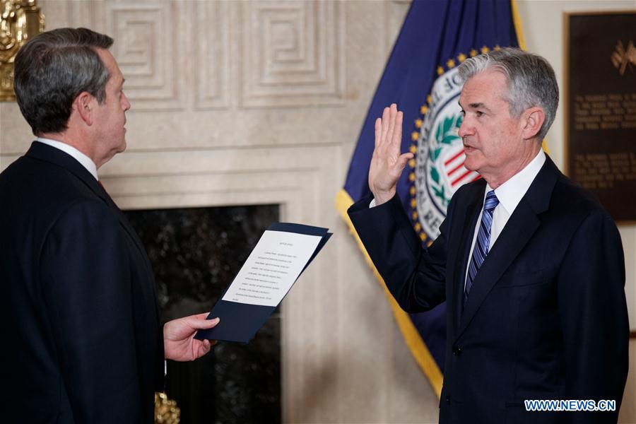 Jerome Powell (R) attends the sworn-in ceremony as he takes the oath of office as Chairman of the U.S. Federal Reserve, succeeding Janet Yellen, in Washington, the United States. on Feb 5, 2018. [Photo/Xinhua]