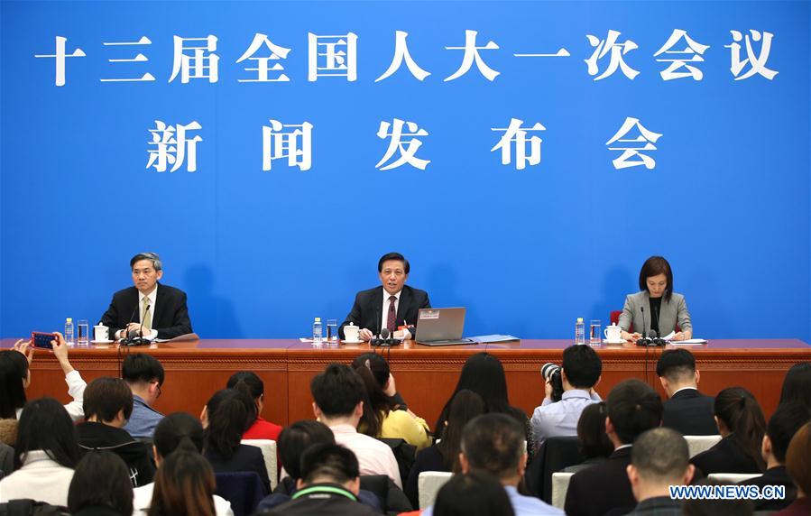 Zhang Yesui (C), spokesperson for the first session of the 13th National People's Congress (NPC), speaks during a press conference on the NPC session at the Great Hall of the People in Beijing, capital of China, March 4, 2018. The first session of the 13th NPC will open in Beijing on March 5. [Photo/Xinhua]