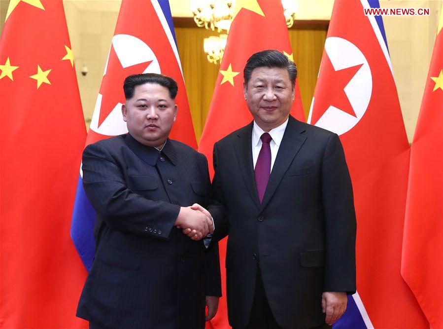 At the invitation of Xi Jinping, general secretary of the Central Committee of the Communist Party of China (CPC) and Chinese president, Kim Jong Un, chairman of the Workers' Party of Korea (WPK) and chairman of the State Affairs Commission of the Democratic People's Republic of Korea (DPRK), paid an unofficial visit to China from March 25 to 28. During the visit, Xi held talks with Kim at the Great Hall of the People in Beijing. [Photo/Xinhua]