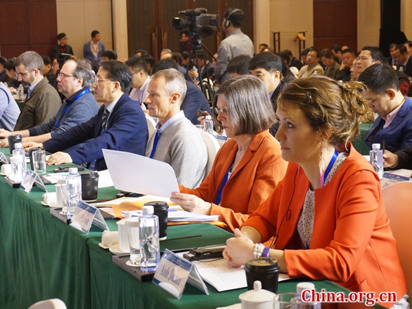 Marine life scholars from Australia, Britain, France, South Korea and the United States listen to speeches delivered at the opening ceremony of the first China (Rushan) International Oyster Forum on Sunday, April 22, 2018 in Rushan, Shandong province in eastern China. [Photo by Zhou Jing/China.org.cn]