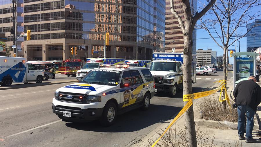 Ambulances are seen near the site where a van struck pedestrians in Toronto, Canada, April 23, 2018. A white van struck multiple pedestrians in Toronto's northern suburbs on Monday and police have taken the driver into custody, police said on Twitter. [Photo/Xinhua]
