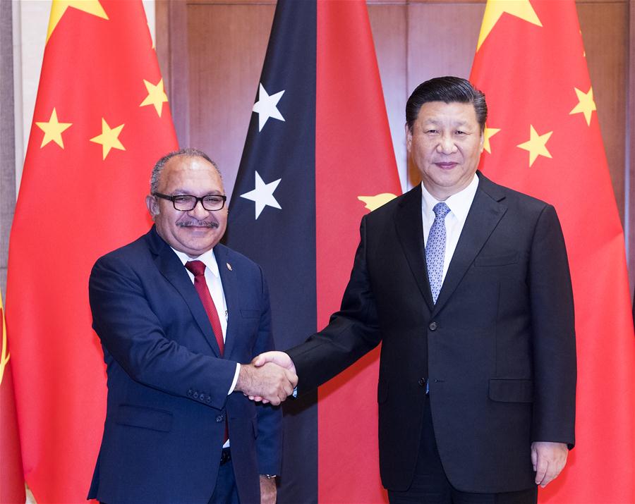 Chinese President Xi Jinping (R) meets with Papua New Guinea's Prime Minister Peter O'Neill at the Diaoyutai State Guesthouse in Beijing, capital of China, June 21, 2018. [Photo/Xinhua]