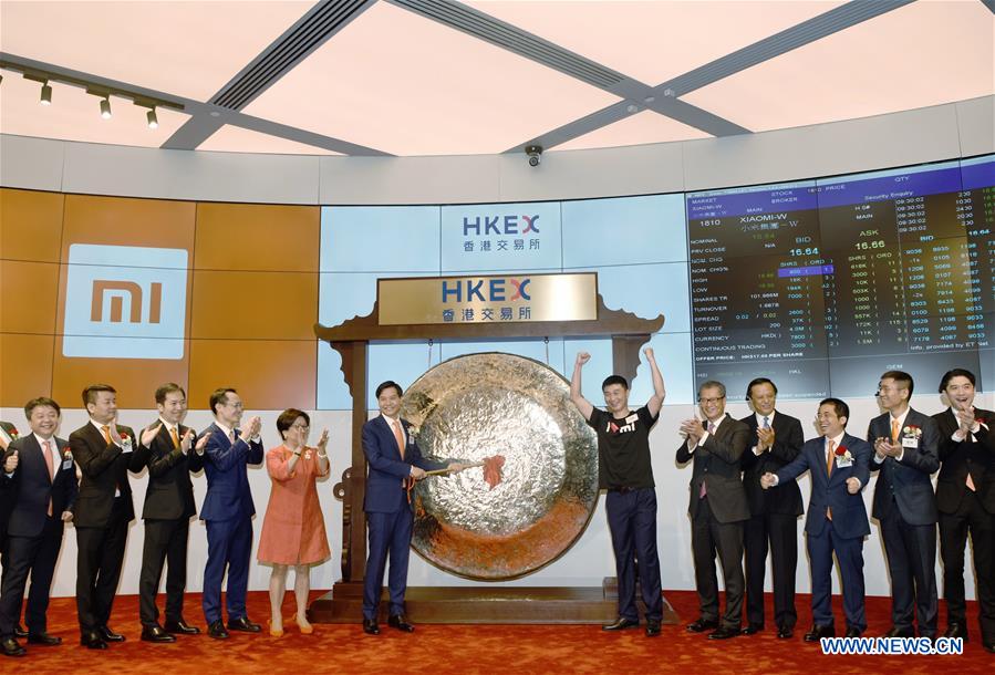 Lei Jun, founder and CEO of Xiaomi, hits a gong at the listing ceremony of Xiaomi in Hong Kong, south China, July 9, 2018. 