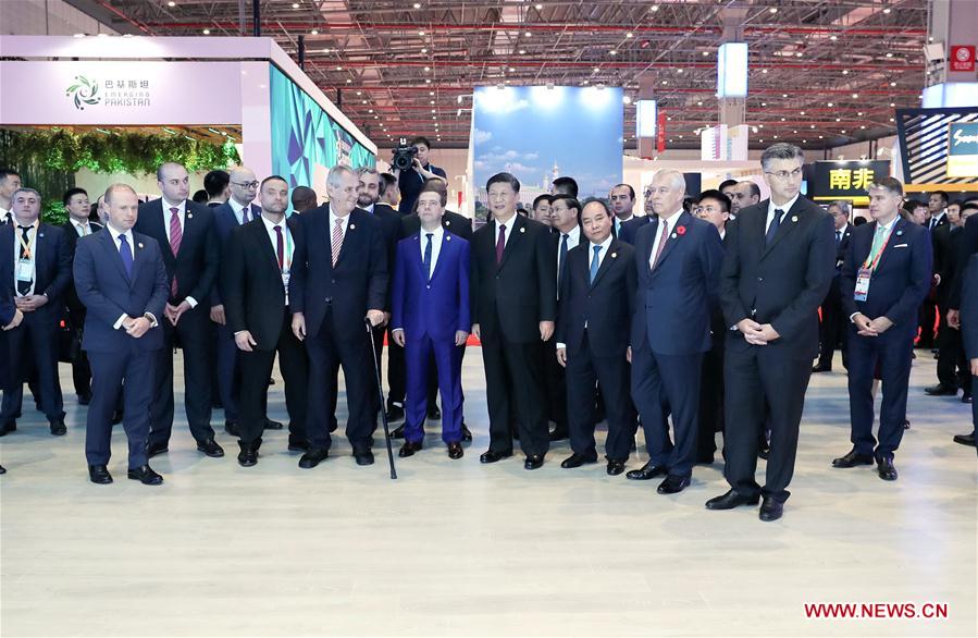 Chinese President Xi Jinping and foreign leaders who are attending the first China International Import Expo (CIIE) tour around the Country Pavilion for Trade and Investment, which showcases development achievements and feature products from more than 80 countries, in Shanghai, east China, Nov. 5, 2018. [Photo/Xinhua]