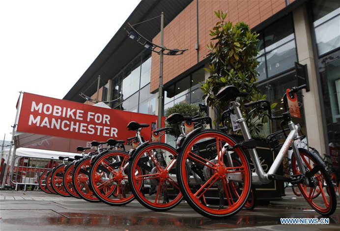 A row of Mobikes are seen in Manchester, Britain on June 29, 2017. [Photo/Xinhua]