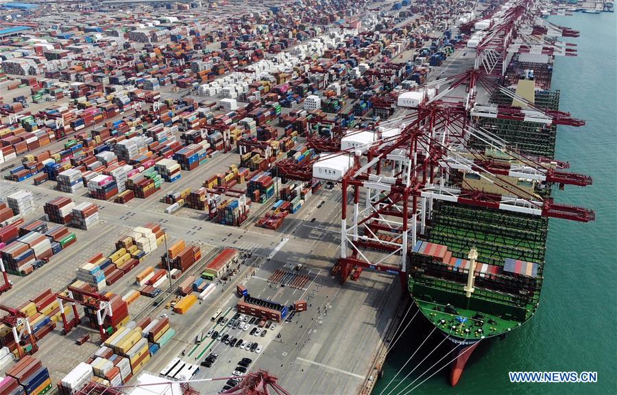 World's largest container ship starts maiden voyage from east China ...