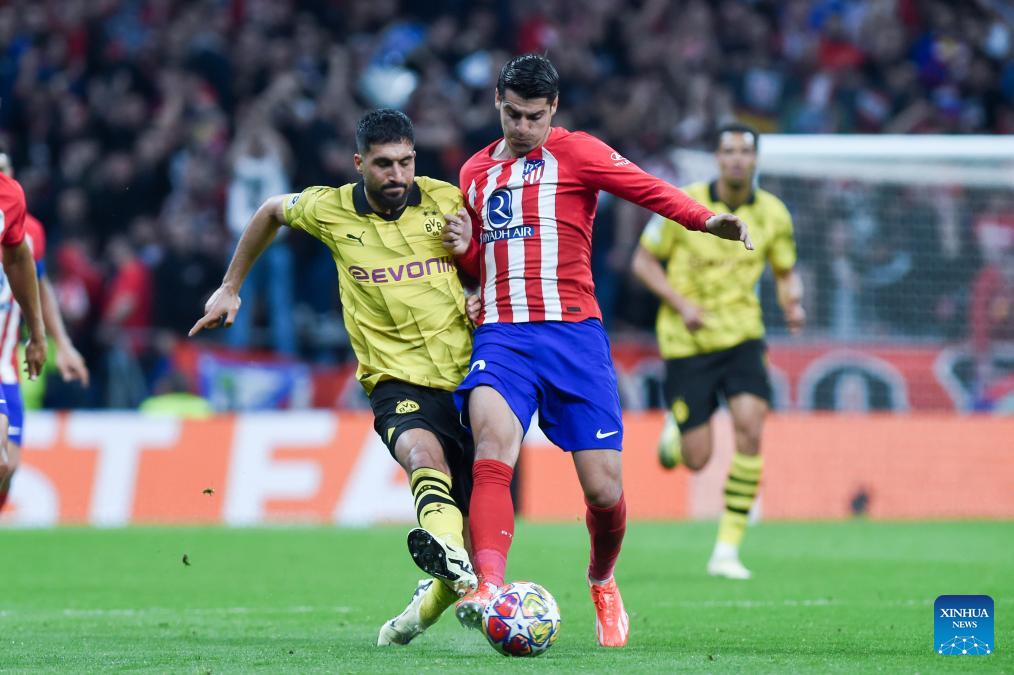 Atlético survive late Dortmund rally to hold on for win